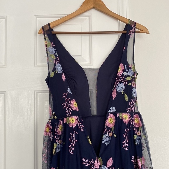 GB formal gown in navy with embroidered pink, yellow, and blue flowers. - Picture 6 of 15